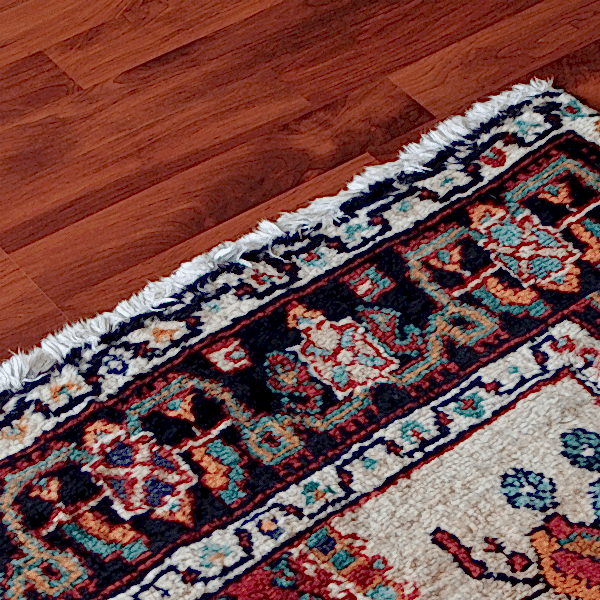 hardwood floor with rug on top